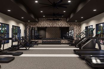 A gym with treadmills, elliptical machines, and a wall of windows. at The Logan Luxury Apartments, Nampa, ID